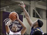  Bowling Green’s Chauncey Orr shoots against Kent State’s Chris Evans. The Falcons improved to 7-11 overall, 2-3 in the MAC.