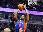  Detroit's Rodney Stuckey shoots over Chicago's Carlos Boozer.