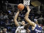  UT's Matt Smith goes to the basket against Akron's Zeke Marshall in Wednesday night's game at Savage Arena. The Rockets fell to 6-10 overall and 2-3 in the MAC.