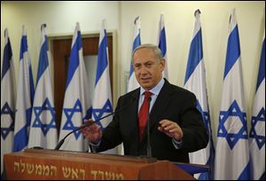 Israel's Prime Minister Benjamin Netanyahu delivers a statement at his office in Jerusalem today.
