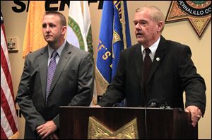 Bernalillo County Sheriff Dan Houston, right, and Lt. Sid Covington answer questions about the shooting deaths of five family members during a news conference at the sheriff's headquarters in Albuquerque, N.M., Tuesday.