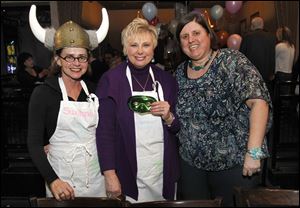 From left: Suzanne Rorick, executive director of the opera, Liz Ference and Susan Conda are celebrity waiters during Toledo Opera Guild's Celeb wait night at Fat Fish Blues and Comedy Club in Perrysburg, Ohio.