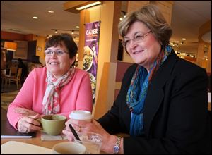 Sisters-in law Holly Stacy, left, and Doris Herringshaw talk at Panera Bread in Perrysburg. They will each serve as commissioners for the first time; Ms. Stacy in Seneca, Ms. Herrginshaw in Wood.