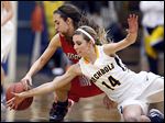  Archbold's Taylor Coressel (14) battles Wauseon's Haley Archibeque for  a loose ball during a basketball game Thursday.