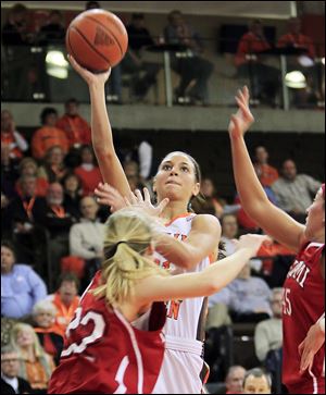 BG's Chrissy Steffen takes a shot over Miami's Hannah Robertson. Steffen was held to four points as the Falcons fell to 12-6.