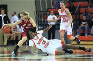 Miami's Hannah Robertson regains possession of the ball after Bowling Green's Alexis Rogers misses on a steal attempt.