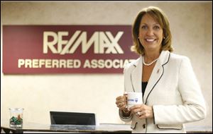 Toledo's RE/Max Preferred, office seen here with national CEO Margaret Kelly, has about 80 agents. It sold 2,024 homes last year, with more than $218 million in sales volume.