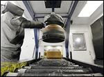  A robot paints brake drums at Webb Wheel Products in Cullman, Ala.  Webb Wheel hasn't added a factory worker in three years, though it's making 300,000 more drums annually, a 25 percent increase, because of robots.