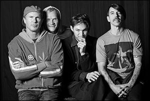 The Red Hot Chili Peppers, from left, drummer Chad Smith, bassist Flea, guitarist Josh Klinghoffer, and singer Anthony Kiedis will headline Coachella 2013.