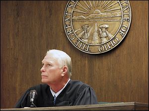 Visiting Judge Thomas Lipps listens to arguments on whether the rape trial should be open to the public. 