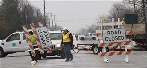 Ohio Department of Transportation workers shut down Airport Highway after a man barricaded himself in his home. 