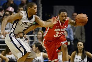 Ohio State's Lenzelle Smith Jr. (32) works past Penn State's D.J Newbill (2) during the first half of an NCAA college basketball game in State College, Pa.