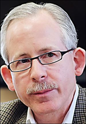 Brent Cameron, an associate professor of bioengineering at the University of Toledo and inventor of a device being developed to measure blood glucose levels by photographing the iris. 