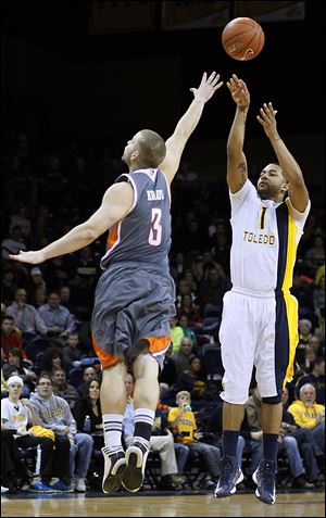 UT guard Dominique Buckley, who led the Rockets with 20 points, shoots a 3-point-shot against Bowling Green's Luke Kraus in Saturday night's game at Savage Arena.