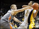  University of Toledo guard Dominique Buckley (1) tries to get around Bowling Green State University guard Luke Kraus.