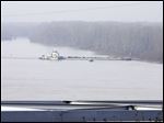  The towboat Nature Way Endeavor banks a barge against the western bank of the Mississippi River on Sunday. The river was closed to all traffic eight miles north and south of Vicksburg.