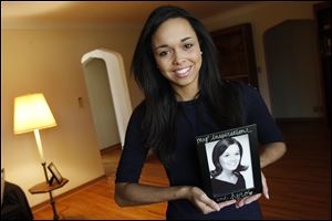 Sarah Stachak holds a photo of her mother, Maryellen Stachak, who died when Sarah was 9. She recalls feeling alone as the rest of her family tried to cope as well.