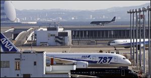 A grounded All Nippon Airways' Boeing 787 is parked on the tarmac at Haneda airport in Tokyo. Although a fire destroyed one of two big batteries on a Boeing 787 parked at Logan Airport in Boston three weeks ago, a quick examination of the second battery found 