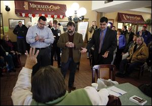 Toledo city councilmen Shaun Enright, left, Mike Craig, and Joe McNamara respond to questions at Saturday’s event.