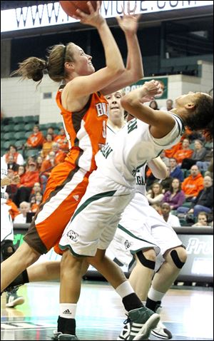 Bowling Green's Bailey Cairnduff shoots over Eastern Michigan's Desyree Thomas on Sunday. The freshman led BG with 18 points.