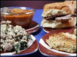  Clockwise from bottom left, Joe's Special, cioppino, pit beef sandwich and crab cakes.