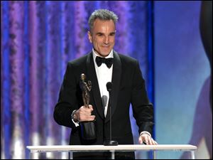 Daniel Day-Lewis accepts the awards for outstanding male actor in a leading role for Lincoln at the 19th Annual Screen Actors Guild Awards on Sunday at the Shrine Auditorium in Los Angeles.