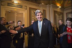 Sen. John Kerry, (D., Mass.), emerges after a unanimous vote by the Senate Foreign Relations Committee approving him to become America's next top diplomat, replacing Secretary of State Hillary Clinton