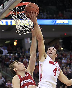 Ohio State's Aaron Craft shoots over Wisconsin's Sam Dekker during the second half of Tuesday's game in Columbus. Craft finished with 13 points.