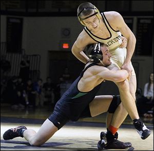  Perrysburg's Ryan Roth, right, beat Delta's Tyler Fahrer in the 145-pound final at the Perrysburg Invitational Tournament. Roth, a senior, is 23-6 this year.