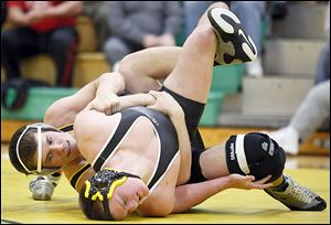 Clay's Jarred Gray pinned Perrysburg's Mark Delas in 3 minutes, 45 seconds to win the 220-pound match Wednesday night.