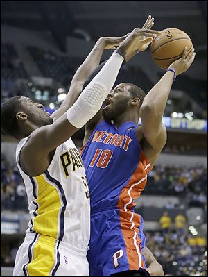 The Pistons' Greg Monroe puts up a shot against the Pacers' Roy Hibbert during the first half of Wednesday's game. Monroe finished with 18.