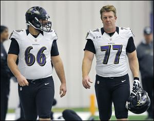 Gino Gradkowski, left, walks with Baltimore teammate Matt Birk. The rookie center, the brother of former UT standout Bruce Gradkowksi,  was drafted by the Ravens in the fourth round.