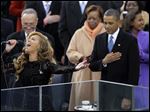  President Barack Obama stands with his hand over his heart as Beyonce performed the national anthem at the ceremonial swearing-in at the U.S. Capitol during the 57th Presidential Inauguration in Washington.