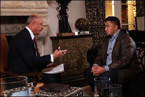 Talk show host Dr. Phil McGraw, left, interviews Ronaiah Tuiasosopo during taping for the 