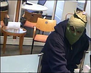 A masked man robs a Huntington Bank in Northwood.