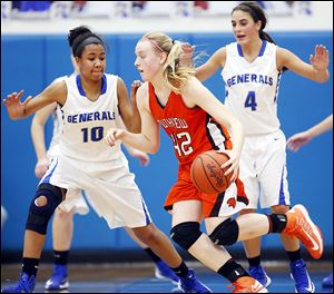 Southview’s Emily Westphal drives past Anthony Wayne’s Jasmine Bonivel during the Cougars’56-49 victory on Thursday. Westphal finished with 12 points for Southview.