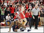  Ohio State fans celebrate with Logan Stieber after he pins Illinois' Daryl Thomas during their 133-pound match at Oak Harbor High School. Stieber had missed the last five duals with an injury.