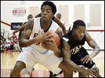  Rogers' Tribune Dailey, Jr., keeps a rebound away from Start's David Cox in the Rams' victory. Dailey scored 12 points.