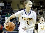  University of Toledo player Naama Shafir, 4, passes behind her back to a teammate against Ohio University.