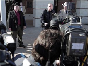 From left, Kaufman District Attorney Mike McLelland, Kaufman Police Chief Chris Aulbaugh, Kaufman County Sheriff David Byrnes update the media on the shooting death of assistant district attorney Mark Hasse,at the Kaufman County Law Enforcement Center Friday Feb. 1, 2013. 