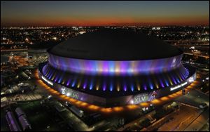 The Superdome, where the NFL Super Bowl XLVII football game between the San Francisco 49ers and Baltimore Ravens will be played, is seen at sunset today in New Orleans.