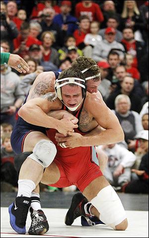 OSU's Cody Magrum, an Oak Harbor alumnus, fails to escape from Illinois' Tony Dallago late in their 184-pound match.