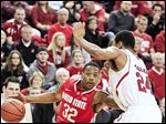  Ohio State's Lenzelle Smith, Jr., (32) tries to drive past Nebraska's Dylan Talley (24) in the first half. The Buckeye guard tossed in 21 points to lead the squad.