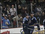 Toledo's forward Randy Rowe 18 is cheered by fans and his teammates after scoring in the first period of today's home game against Reading.