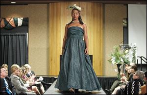 Britanie Powell models a design by Kevin Leistner during an Evening of Fashion & Design featuring international costume designer Vin Burnham at the Pinnacle.