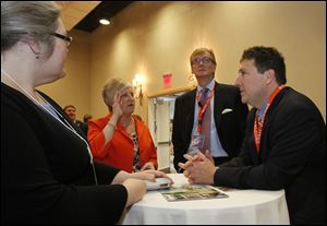 Michael Carroll, of Bowling Green, and director Center for Regional Development; center, said people are confident but the jobs numbers tell a different story.