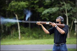 President Obama shoots clay targets on the range at Camp David, Md., last August. He has proposed changes in gun control.