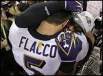  Baltimore Ravens quarterback Joe Flacco, left, embraces linebacker Ray Lewis after defeating the San Francisco 49ers 34-31 in Super Bowl XLVII on Sunday in New Orleans.