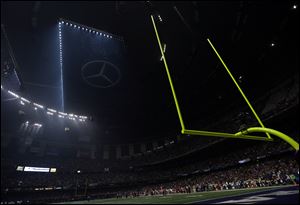Half the lights are out in the Superdome during a power outage with 13 minutes, 22 seconds left in the third quarter of Super Bowl XLVII on Sunday in New Orleans.