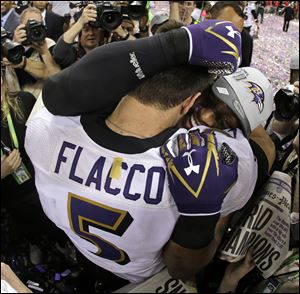 Baltimore Ravens quarterback Joe Flacco, left, embraces linebacker Ray Lewis after defeating the San Francisco 49ers 34-31 in Super Bowl XLVII on Sunday in New Orleans.